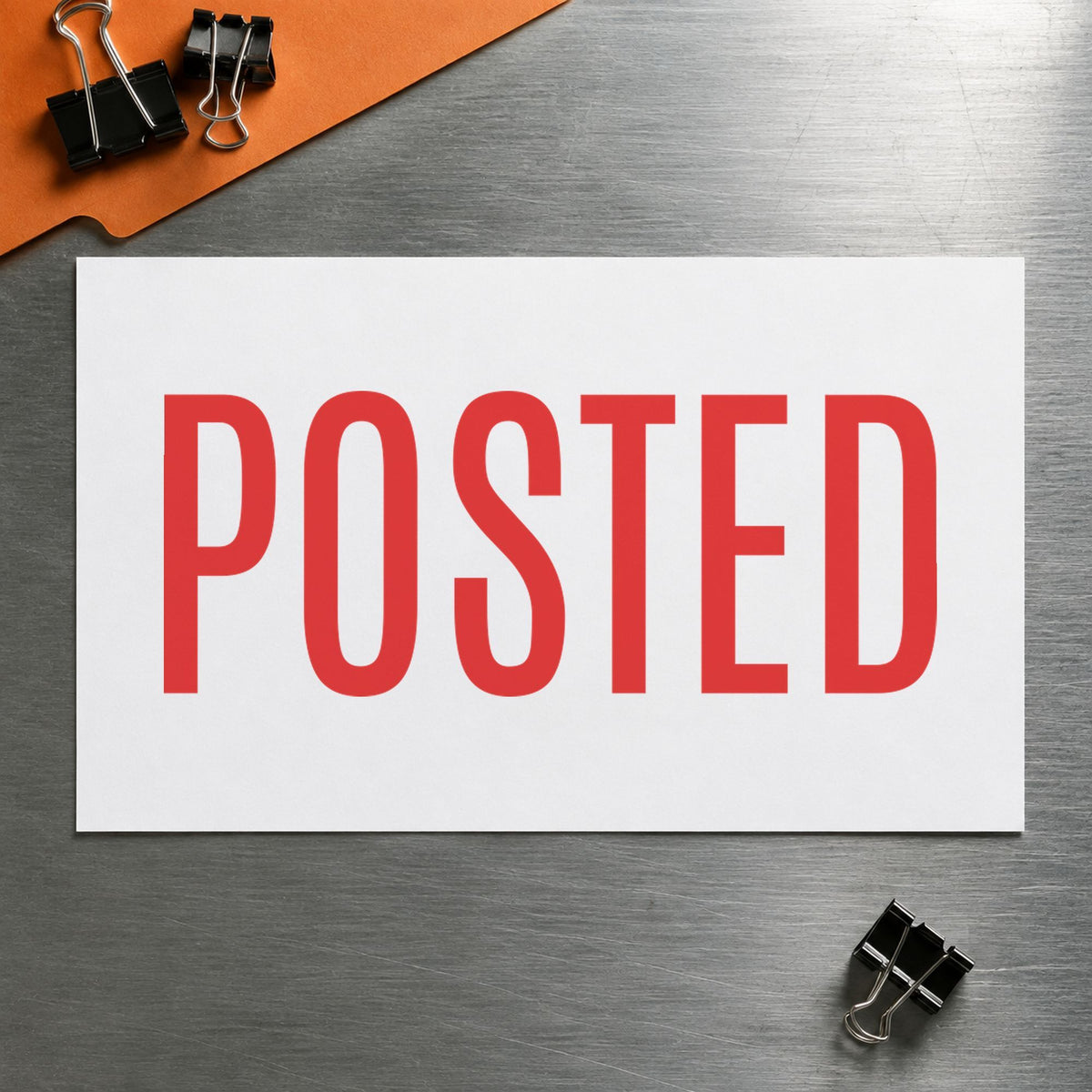 "Posted" Xstamper stamp in use on paper, 1/2 x 1-5/8 in rectangle imprint