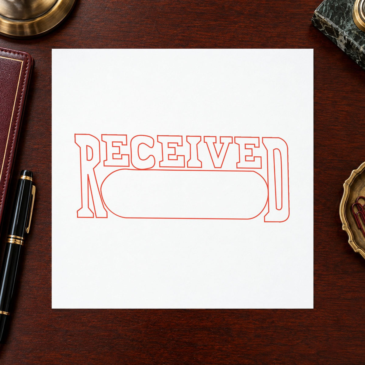 Pre-inked "Date received" stamp marking paperwork in an office setting