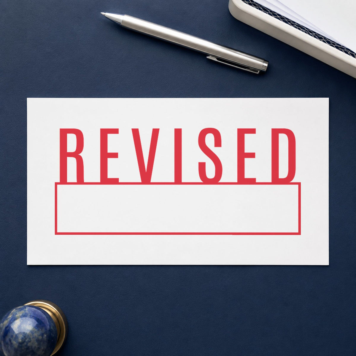 Pre-inked "Revised" stamp applied to a document, 1/2 x 1-5/8 in impression