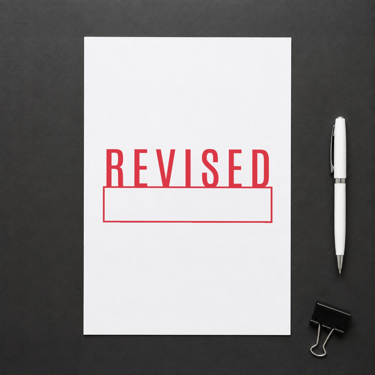"Revised" imprint sized 1/2 x 1-5/8 in on a document page