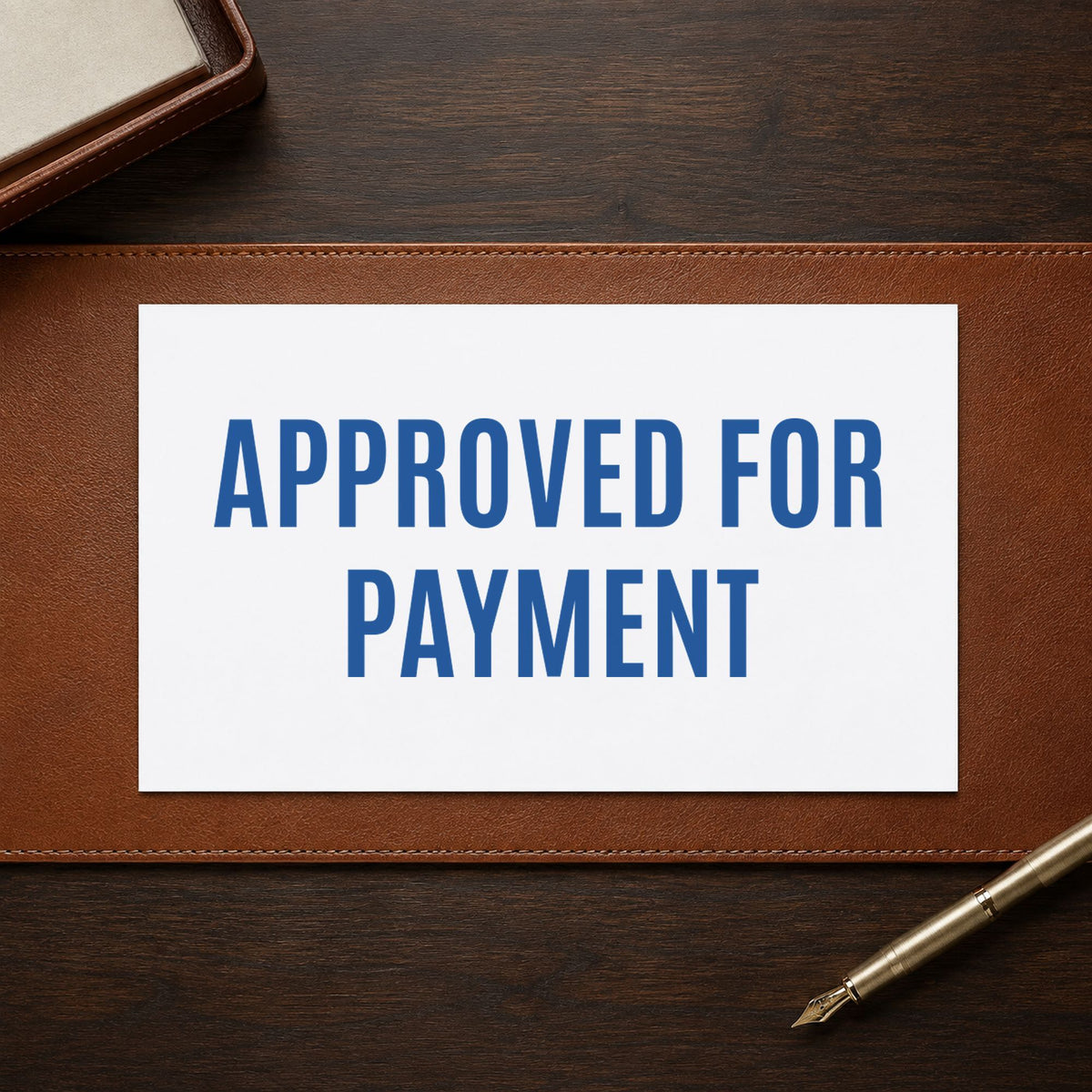 "Approved for payment" stamp pressed on paper, no separate ink pad needed