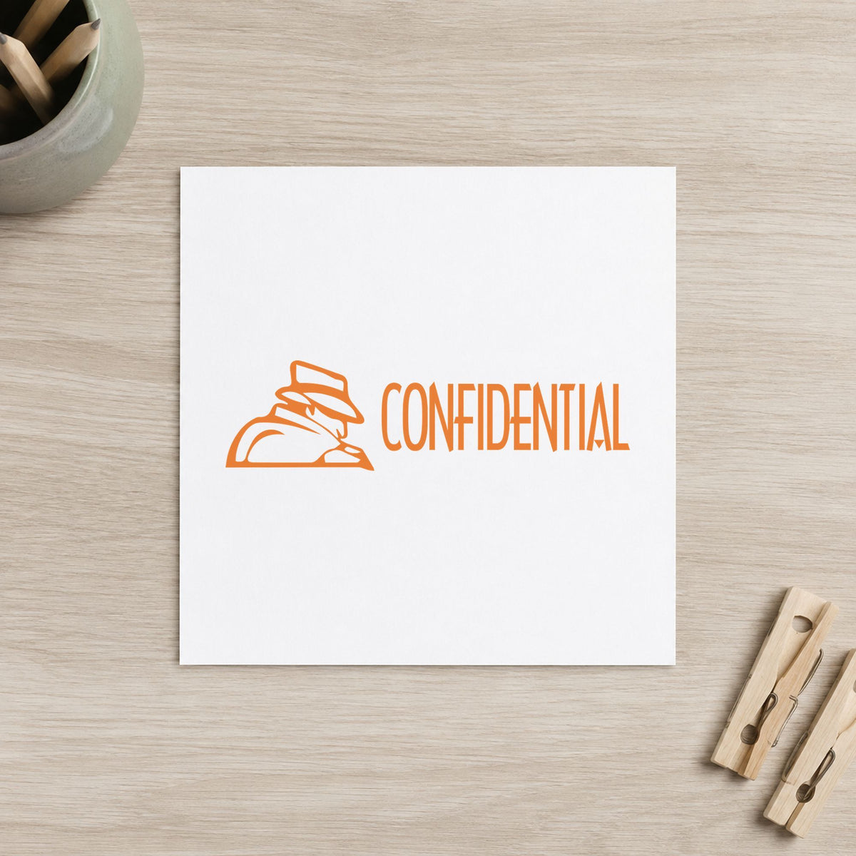 Pre-inked "Confidential" stamp marking paperwork in an office setting
