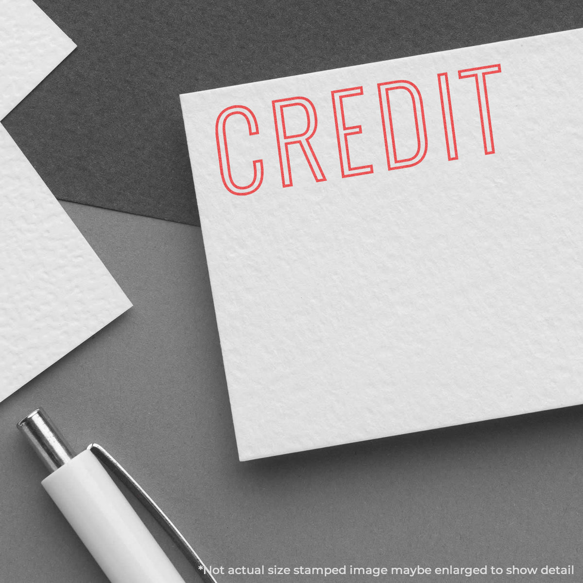 "Credit" pre-inked imprint on a page, rectangle shape at Approximately 1/2 in tall x 1-5/8 in wide