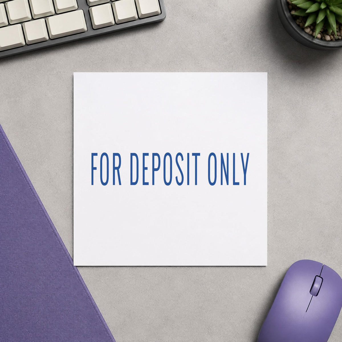 "For deposit only" Xstamper stamp in use on paper, 1/2 x 1-5/8 in rectangle imprint
