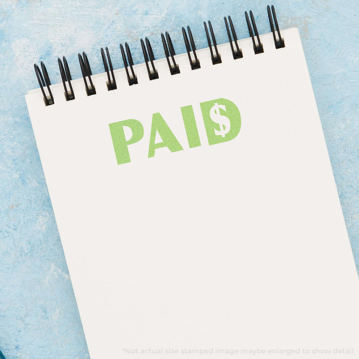 "Paid" pre-inked imprint on a page, rectangle shape at 1/2 x 1-5/8 in