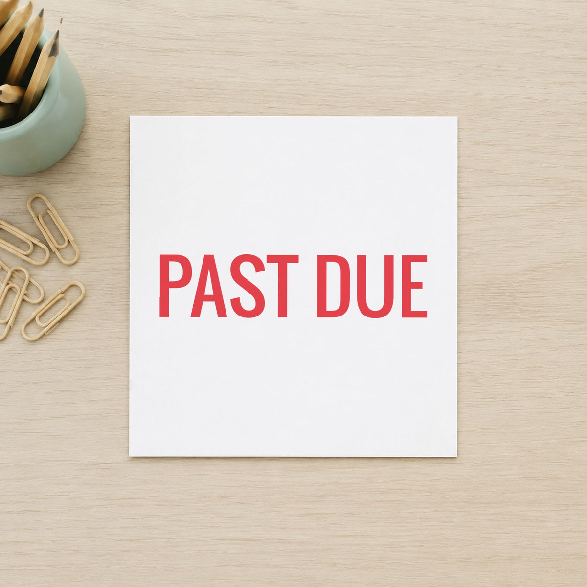 "Past due" stamp pressed on paper, no separate ink pad needed