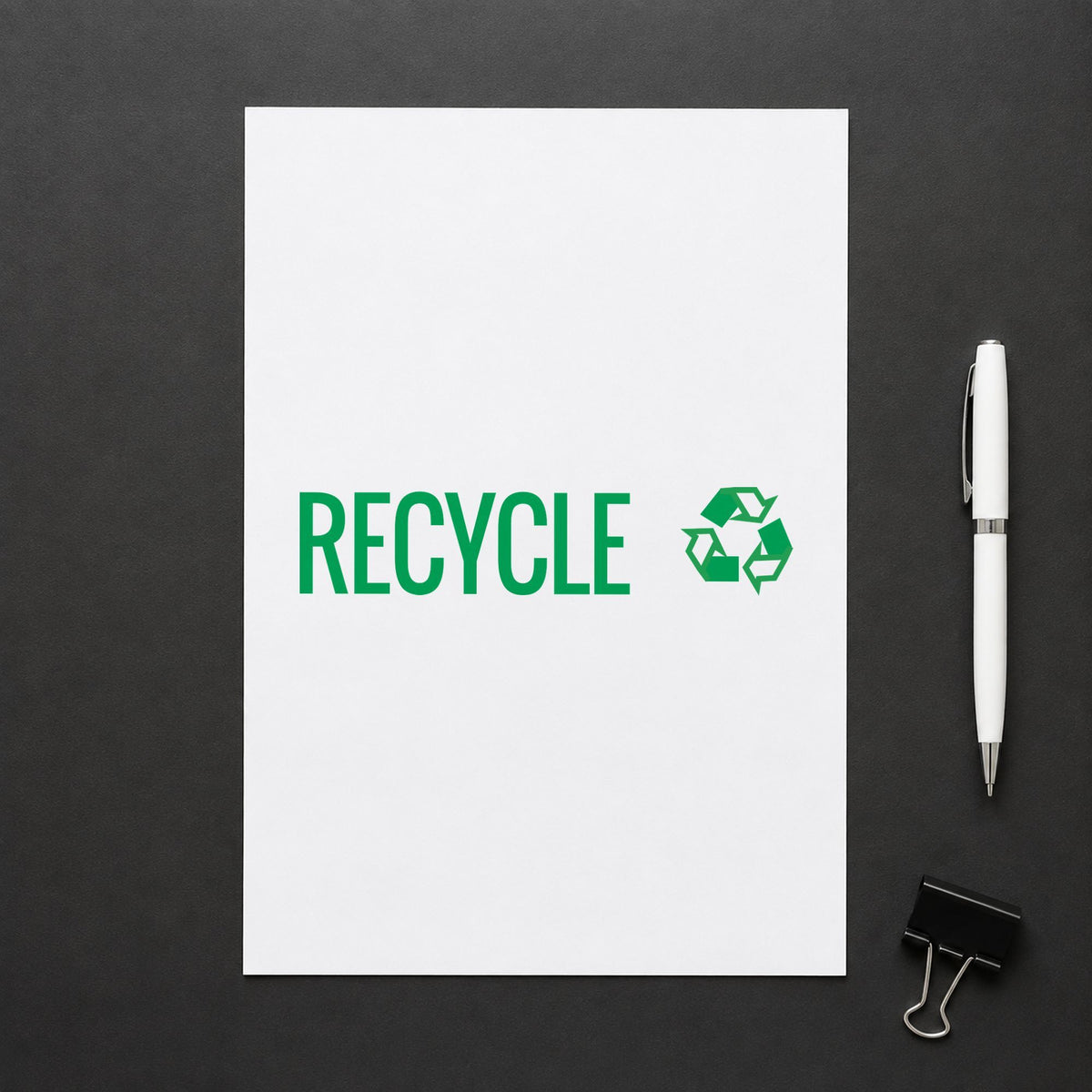 Pre-inked "Recycle" stamp marking paperwork in an office setting