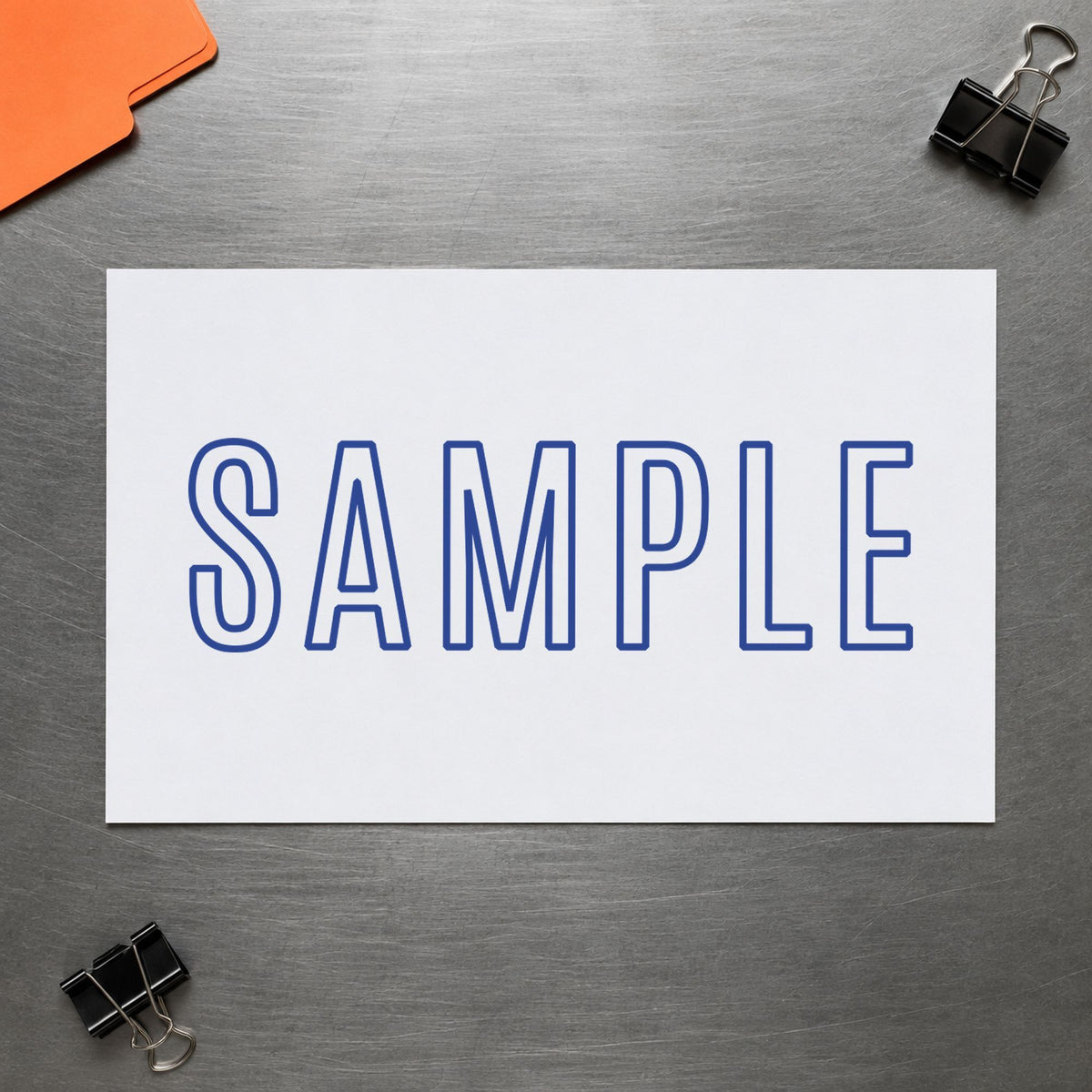 "Sample" Xstamper No. 1002 stamp shown in everyday handling