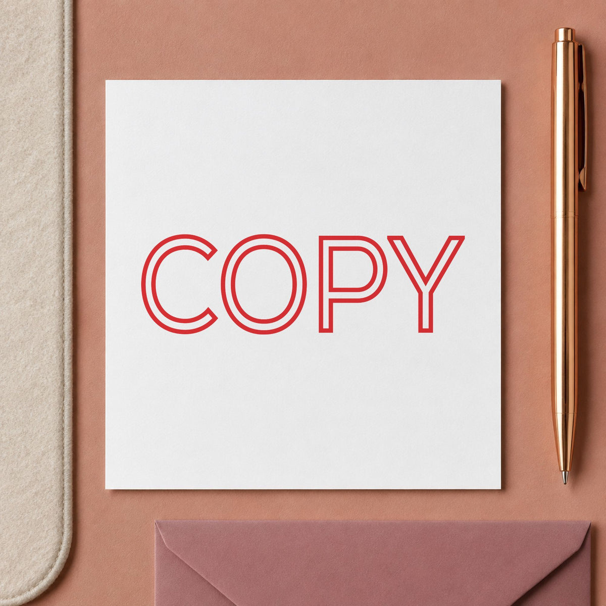 "Copy" Xstamper stamp in use on paper, 7/8 x 2-3/4 in rectangle imprint