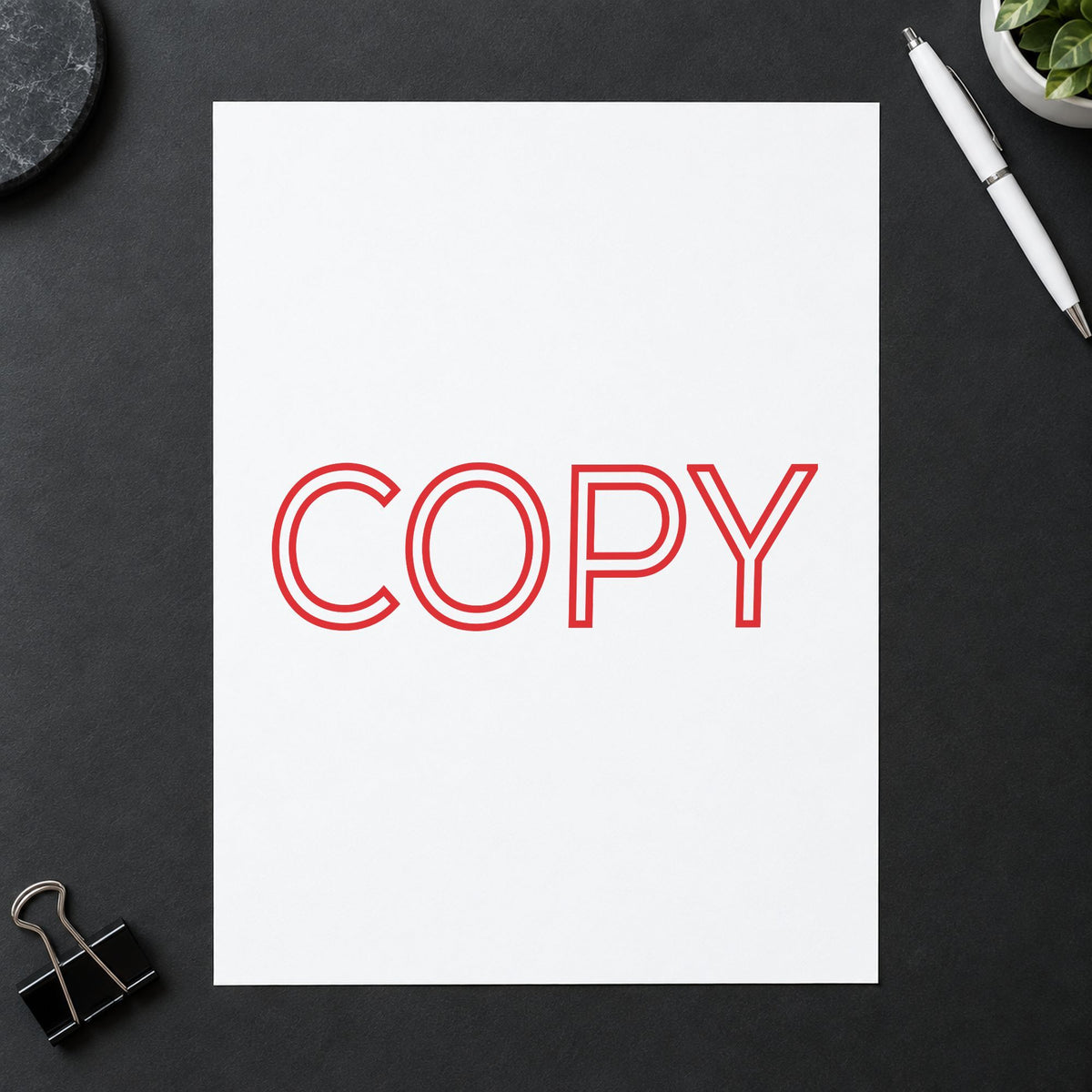 "Copy" Xstamper pre-inked stamp beside its rectangle imprint