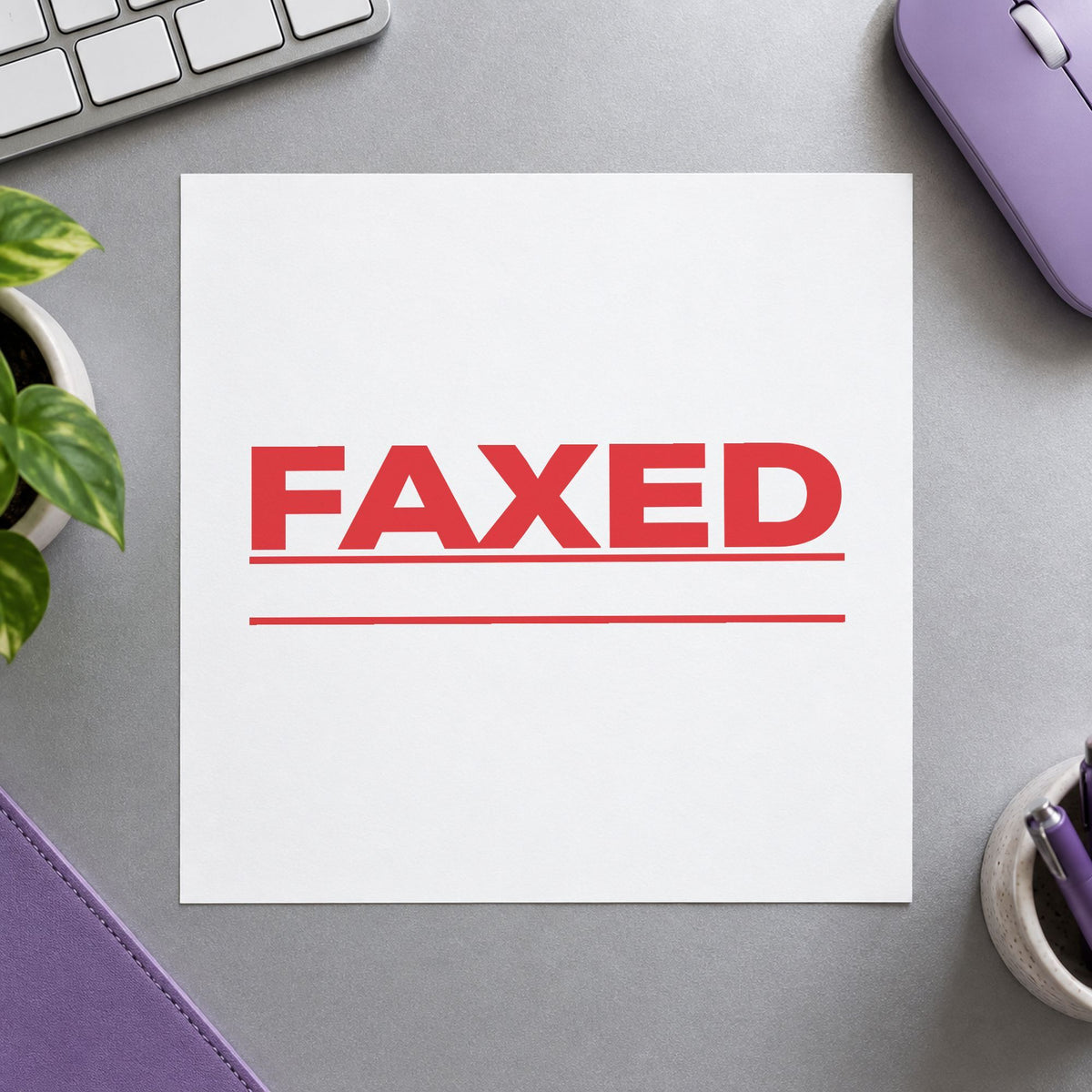 "Faxed" Xstamper stamp in use on paper, 7/8 x 2-3/4 in rectangle imprint