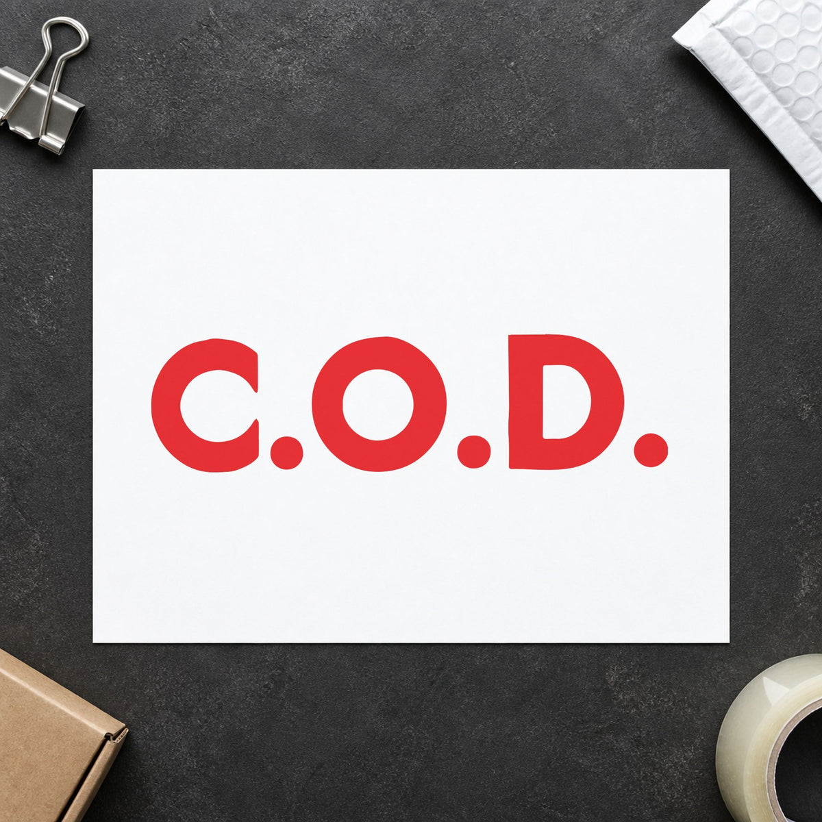 "C.O.D." Xstamper stamp in use on paper, 7/8 x 2-3/4 in rectangle imprint