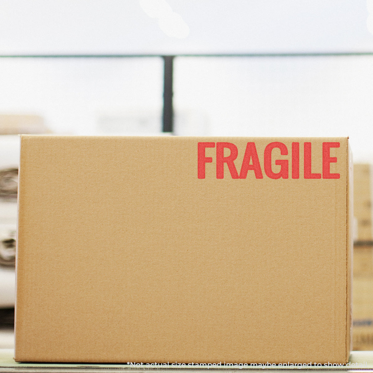 "Fragile" pre-inked imprint on a page, rectangle shape at 7/8 x 2-3/4 in
