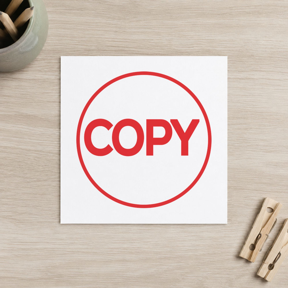 Pre-inked "Copy" stamp marking paperwork in an office setting