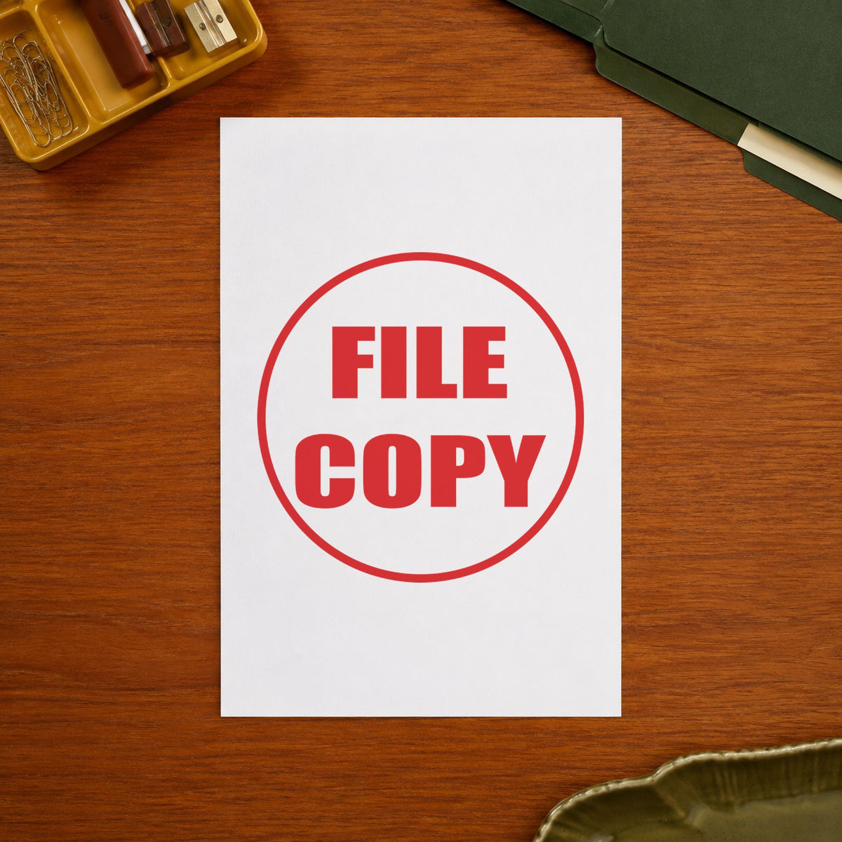 "File copy" Xstamper stamp in use on paper, 5/8 in diameter round imprint