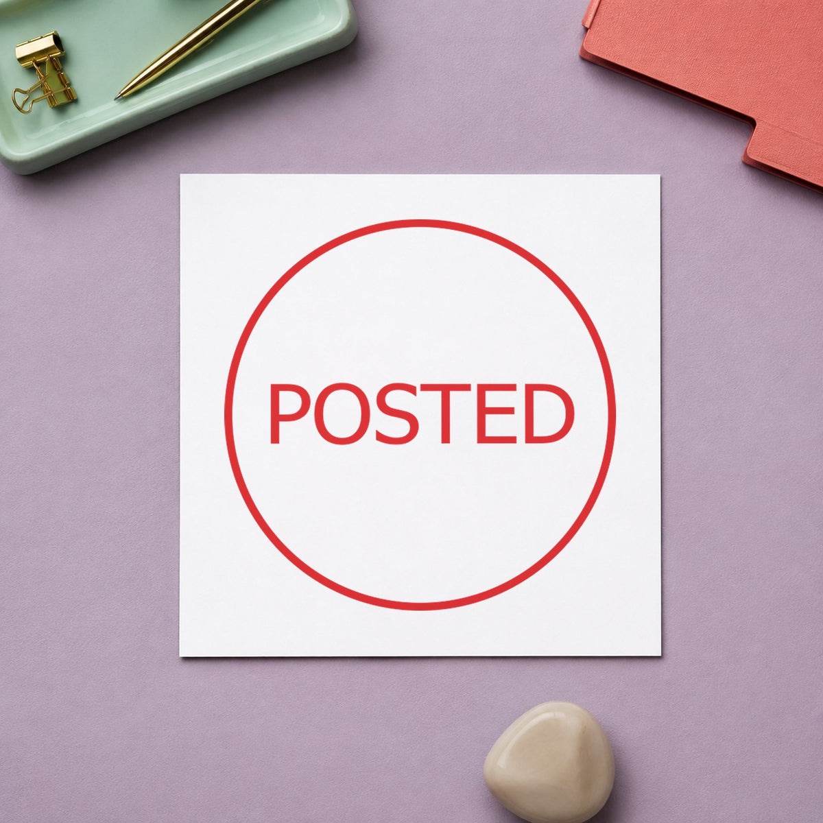"Posted" Xstamper pre-inked stamp beside its round imprint