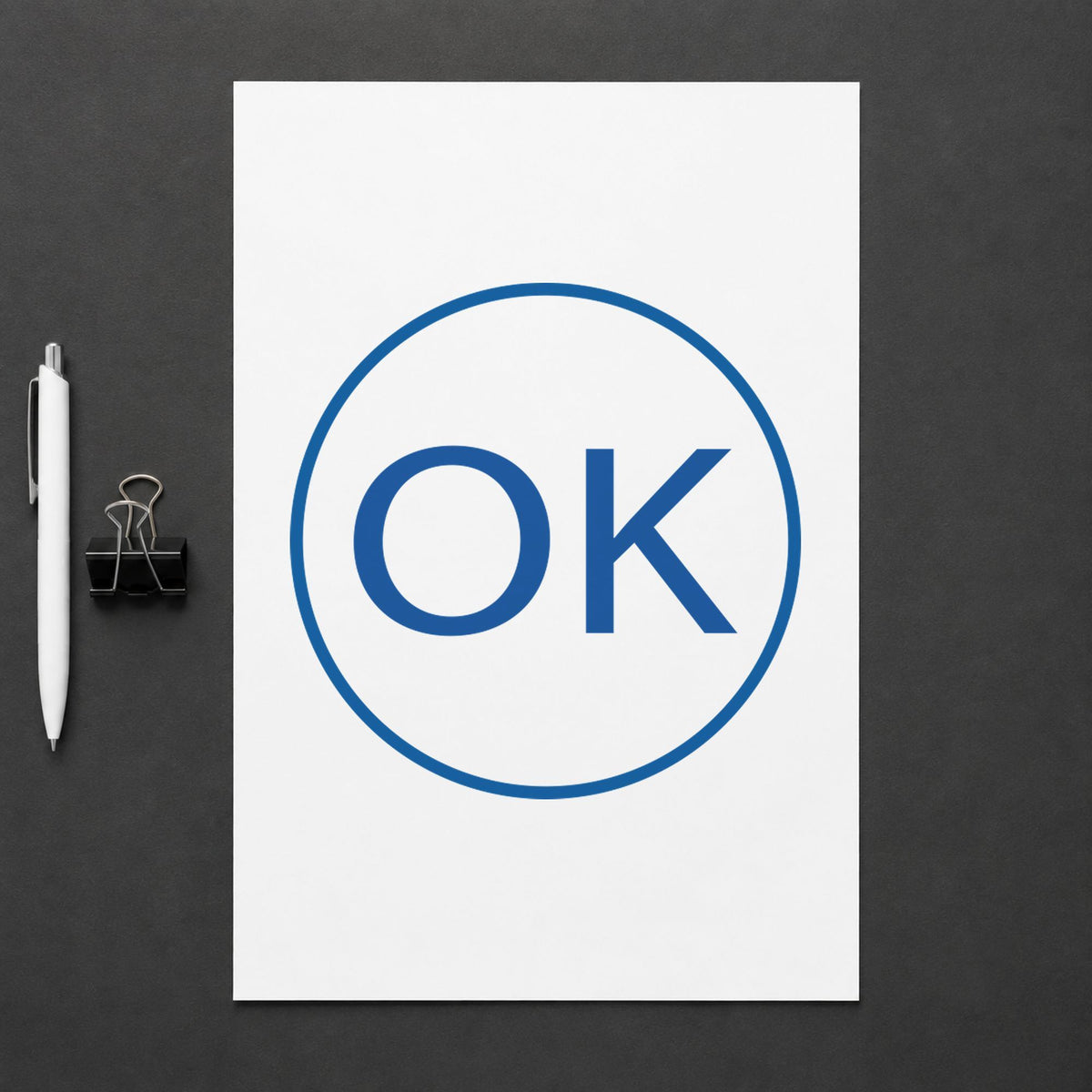 Pre-inked "OK" stamp applied to a document, 5/8 in diameter impression