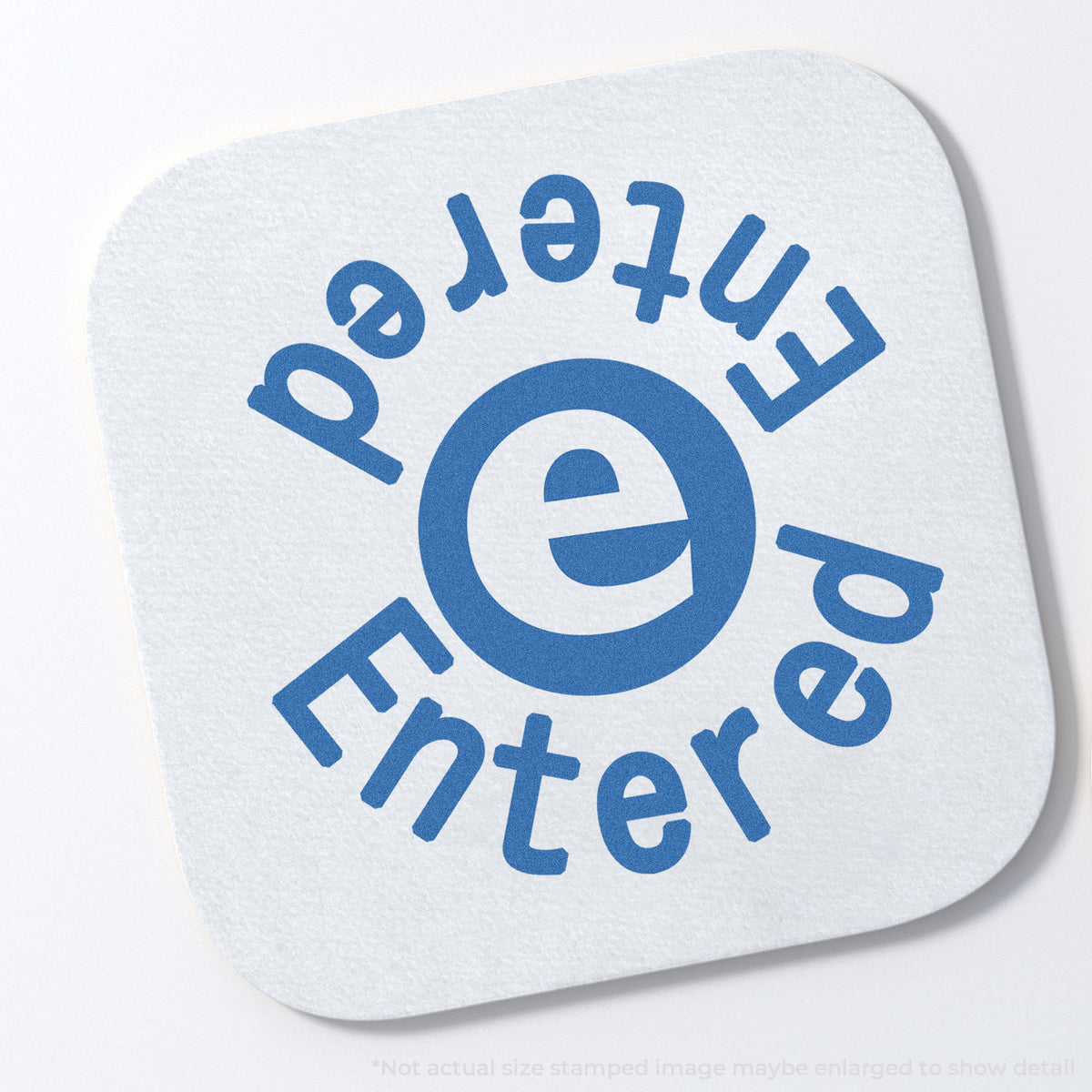 "Entered" stamp and its crisp Approximately 5/8 in diameter impression on paper
