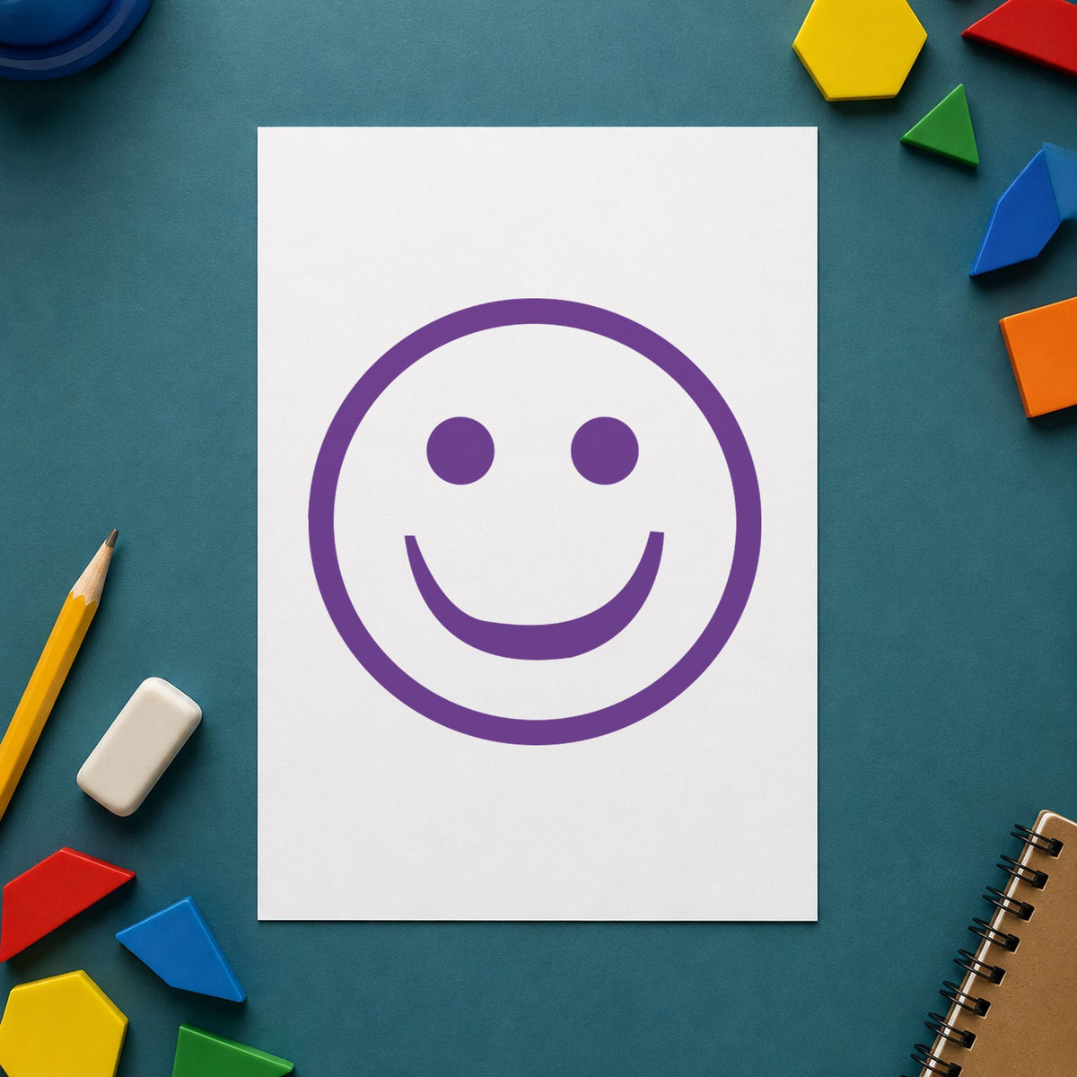 "Smiley face" Xstamper stamp in use on paper, 5/8 in diameter round imprint
