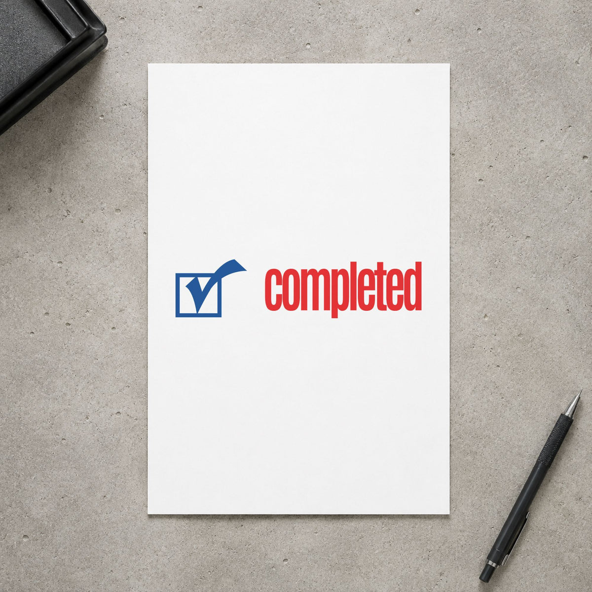 "Completed" stamp pressed on paper, no separate ink pad needed