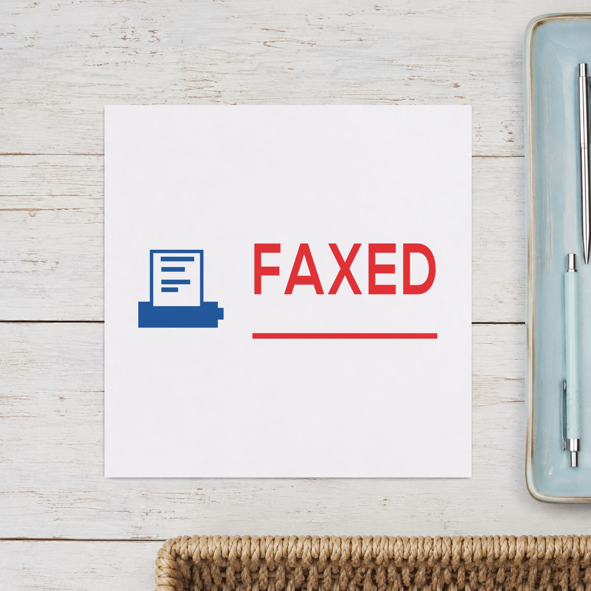 "Faxed" Xstamper pre-inked stamp beside its rectangle imprint
