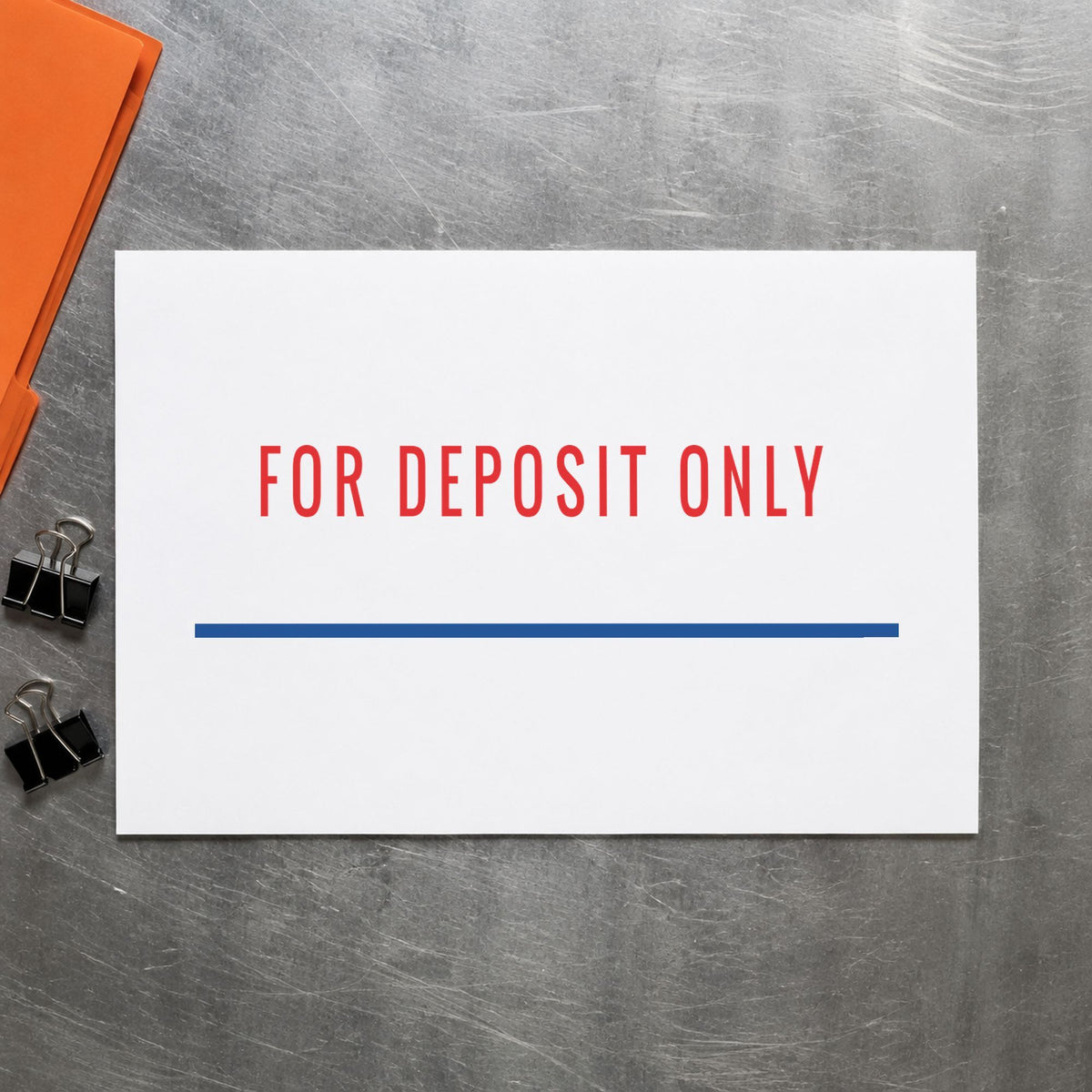 Pre-inked "For deposit only" stamp marking paperwork in an office setting