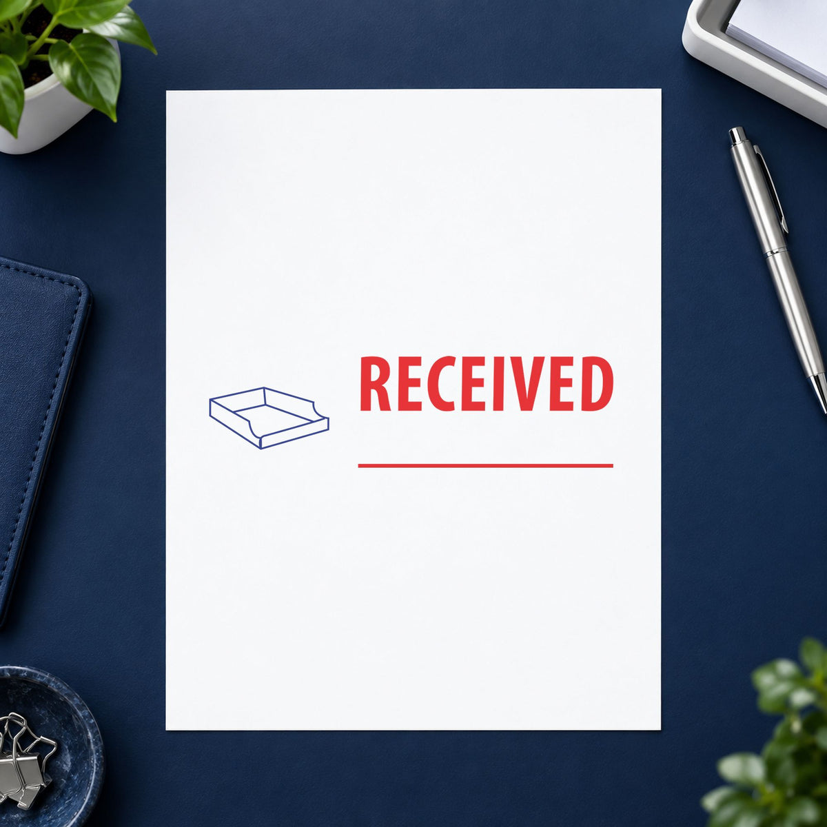 "Received" stamp pressed on paper, no separate ink pad needed
