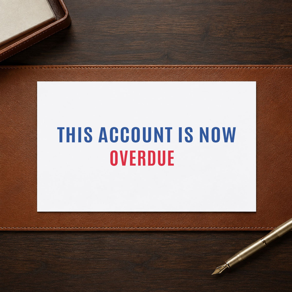 "This account is now overdue" Xstamper stamp in use on paper, Approximately 1/2 in tall x 1-5/8 in wide rectangle imprint