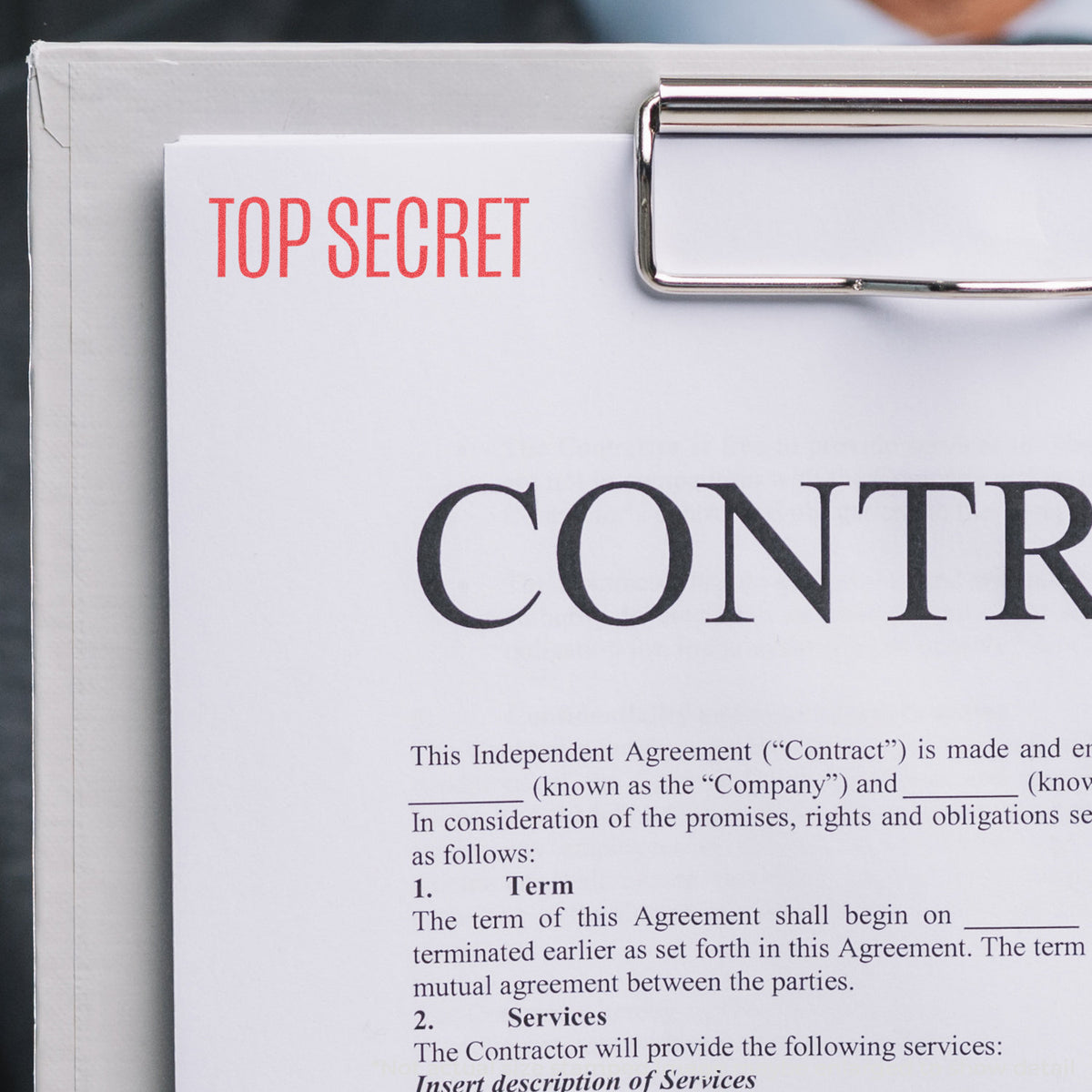 "Top secret" pre-inked imprint on a page, rectangle shape at Approximately 1/2 in tall x 1-5/8 in wide