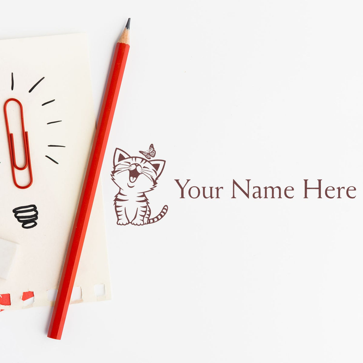 Custom cat stamp and seal design with butterfly, burgundy lettering, and red pencil on white paper.