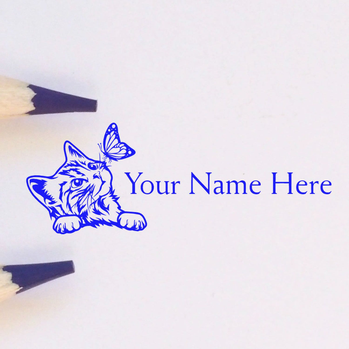 Blue custom stamp and seal with cat and butterfly and Your Name Here text on white paper.