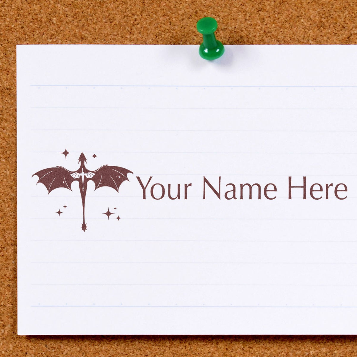 Green pushpin on lined paper showing a brown custom stamp and seal with dragon and Your Name Here text.