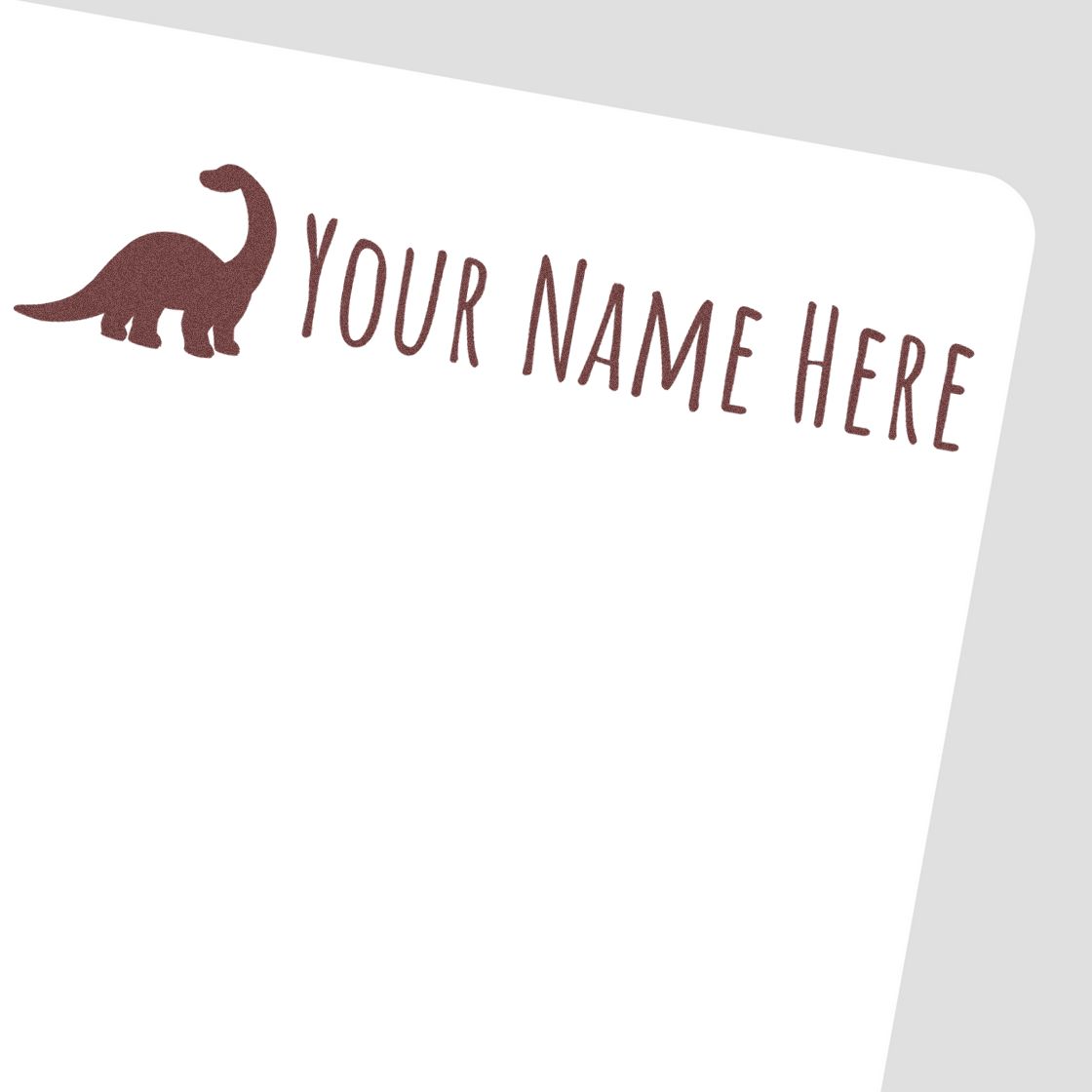 Brown dinosaur custom stamp seal with Your Name Here text on a white background