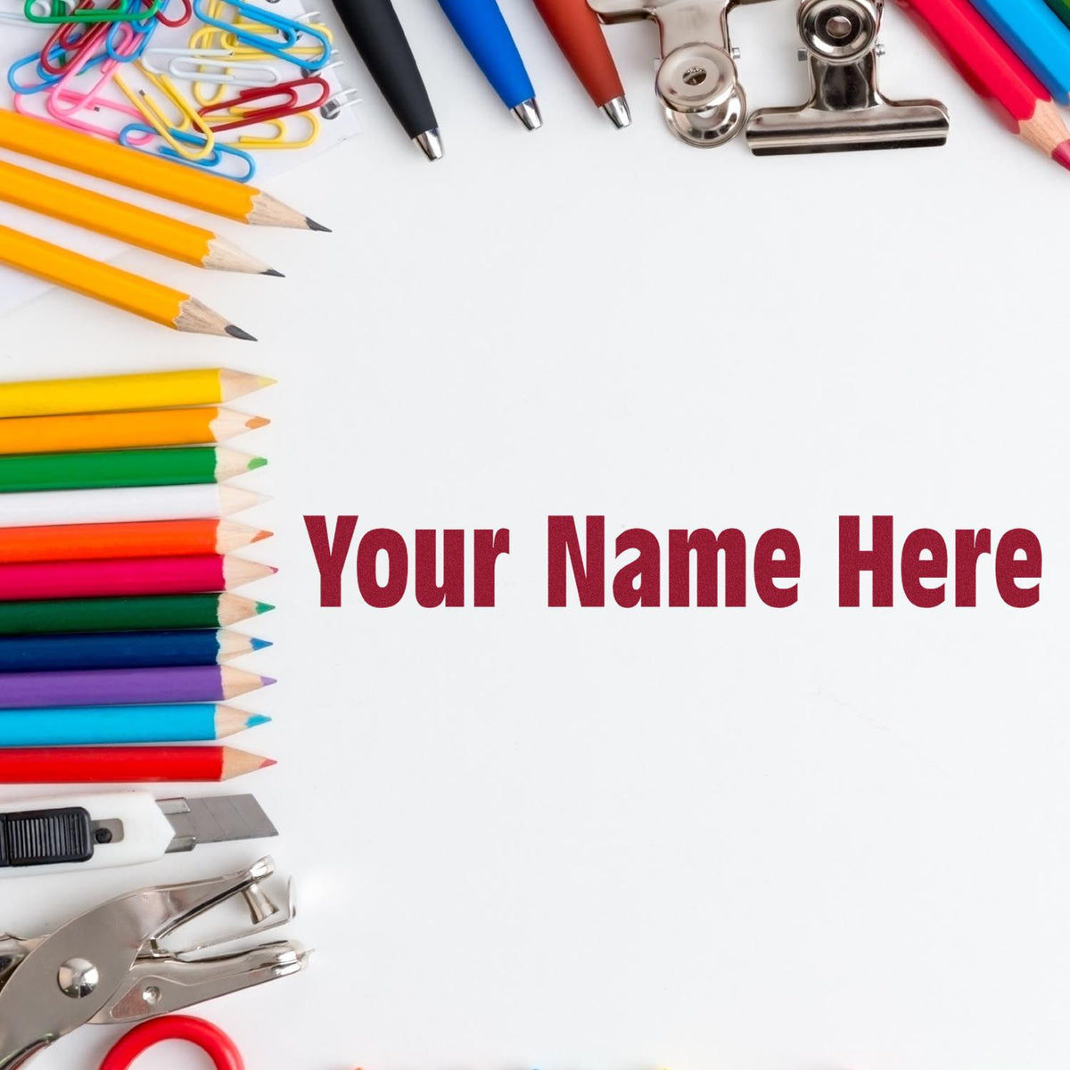 Colorful pencils, pens, clips, and silver stamp-and-seal tools framing customizable "Your Name Here" text.
