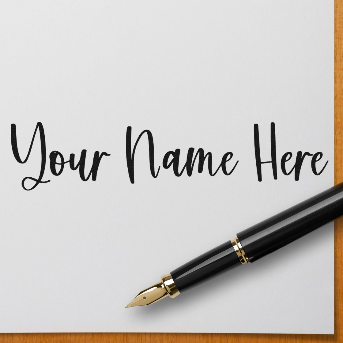 Black custom name stamp text on white paper with a gold-trim fountain pen, showcasing stamp and seal product design.