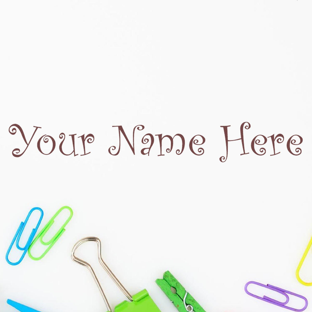 Custom stamp and seal text Your Name Here in brown on white, framed by colorful paper clips and binder clips.
