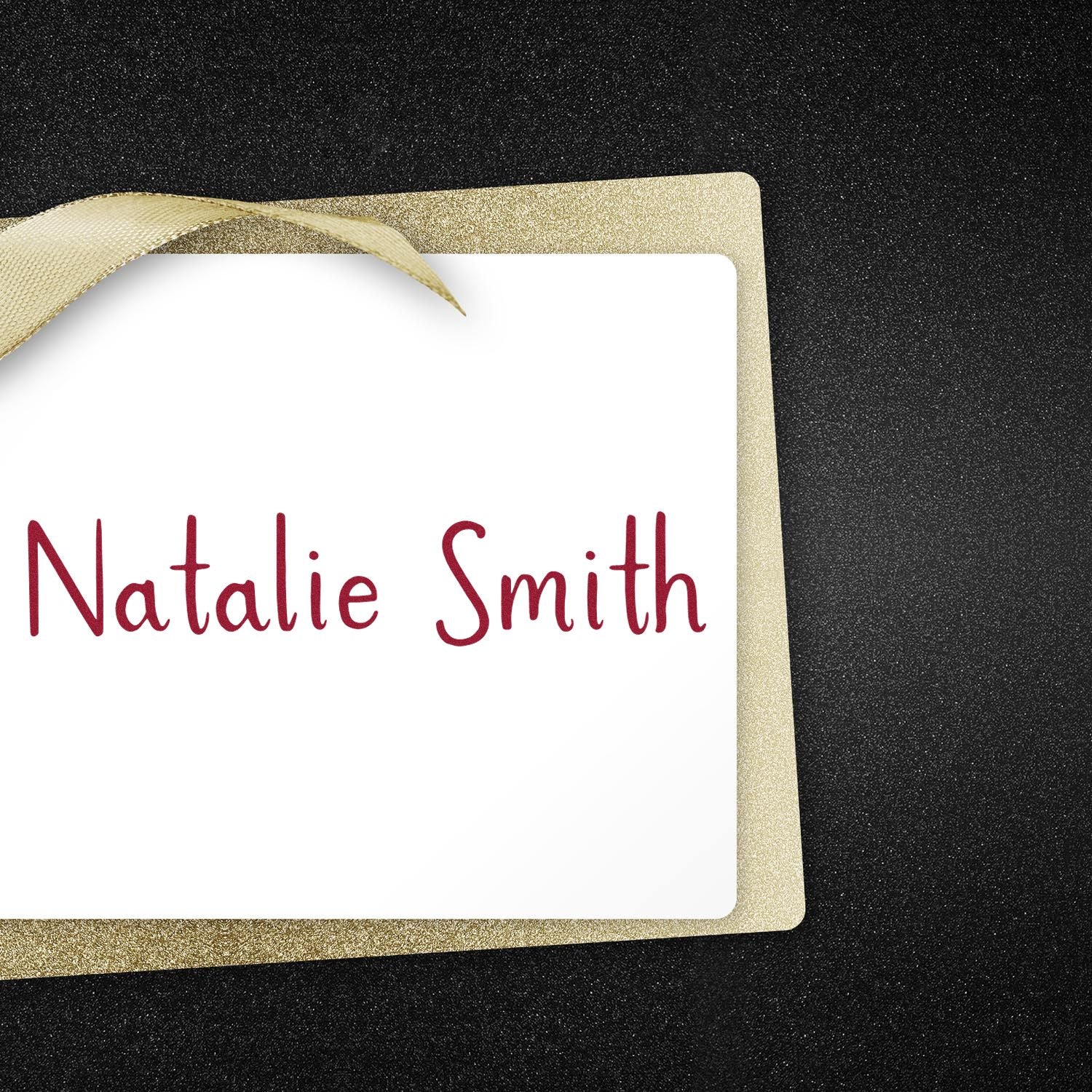 Custom stamp and seal card with gold glitter border and ribbon, white center, and red Natalie Smith text on black background.