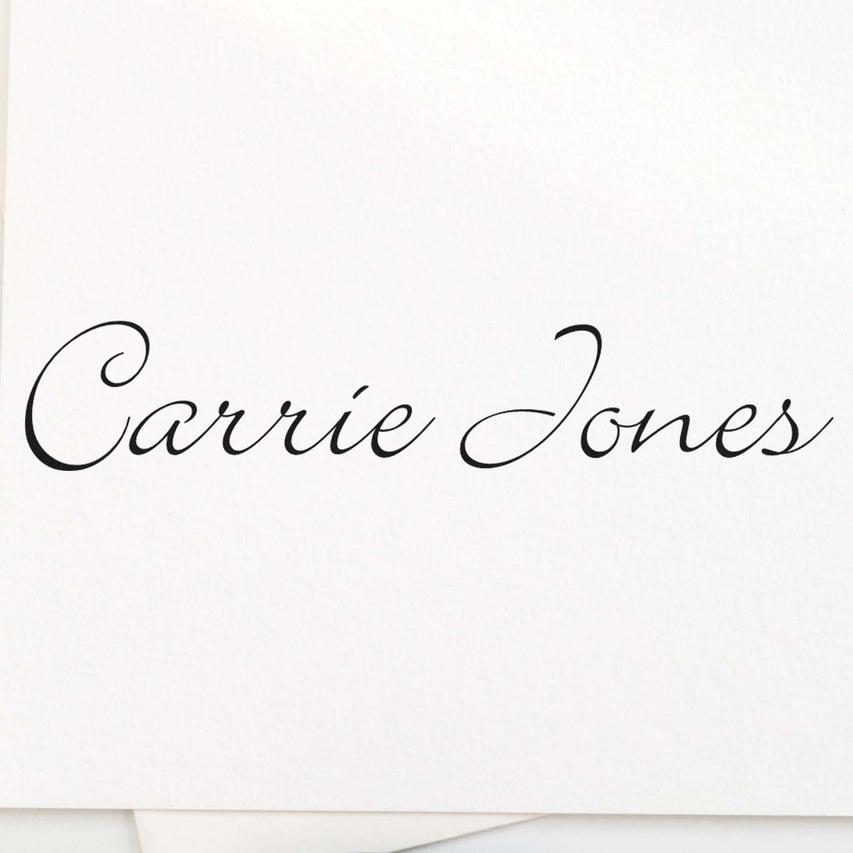 Black cursive Carrie Jones custom stamp and seal on white paper, elegant calligraphy design