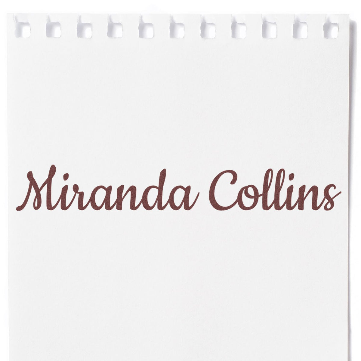 White custom stamp and seal pad with brown script Miranda Collins and perforated top edge.