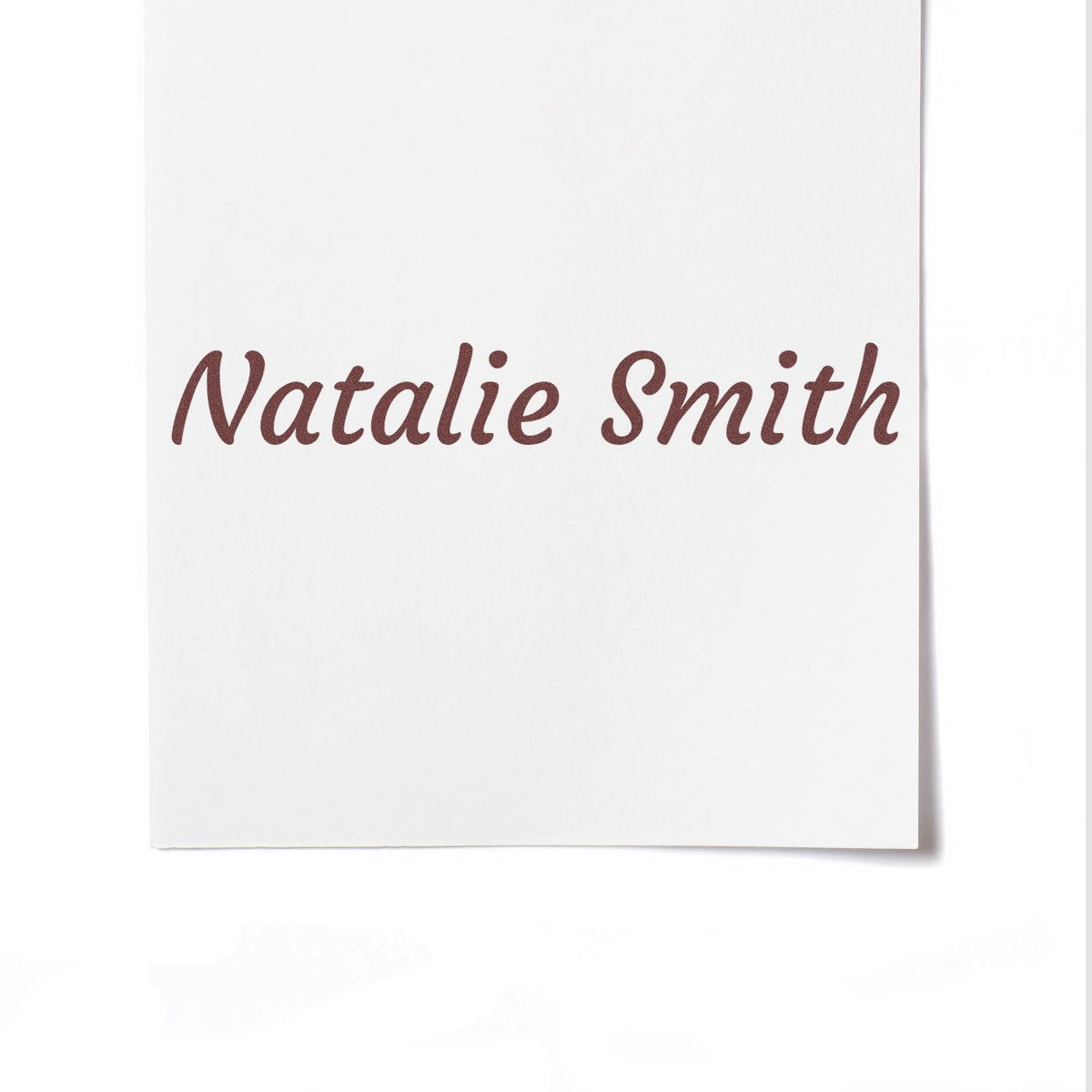 Brown cursive Natalie Smith stamp on white card, showcasing a custom seal product