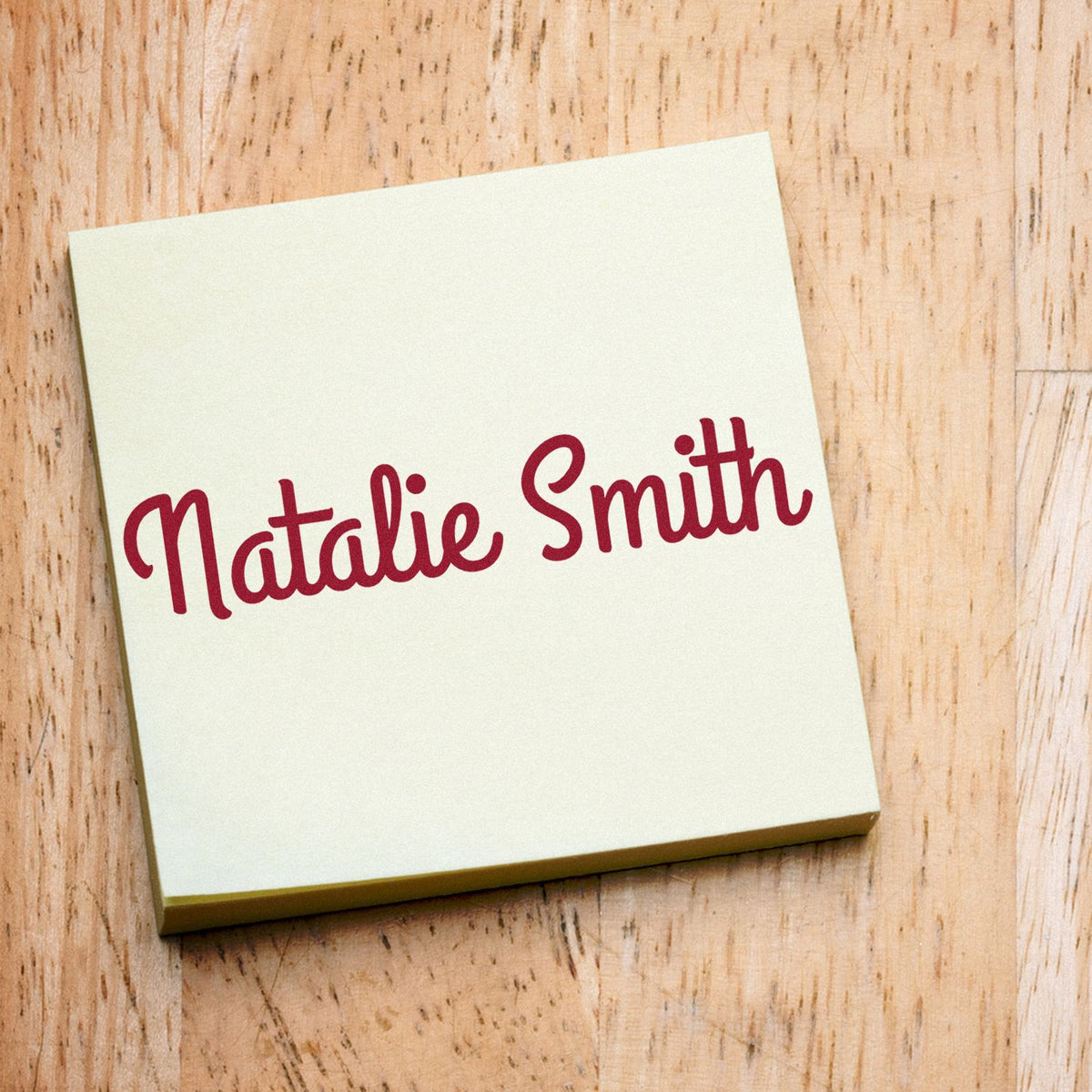 Custom stamp and seal sample with burgundy Natalie Smith script on a cream square card