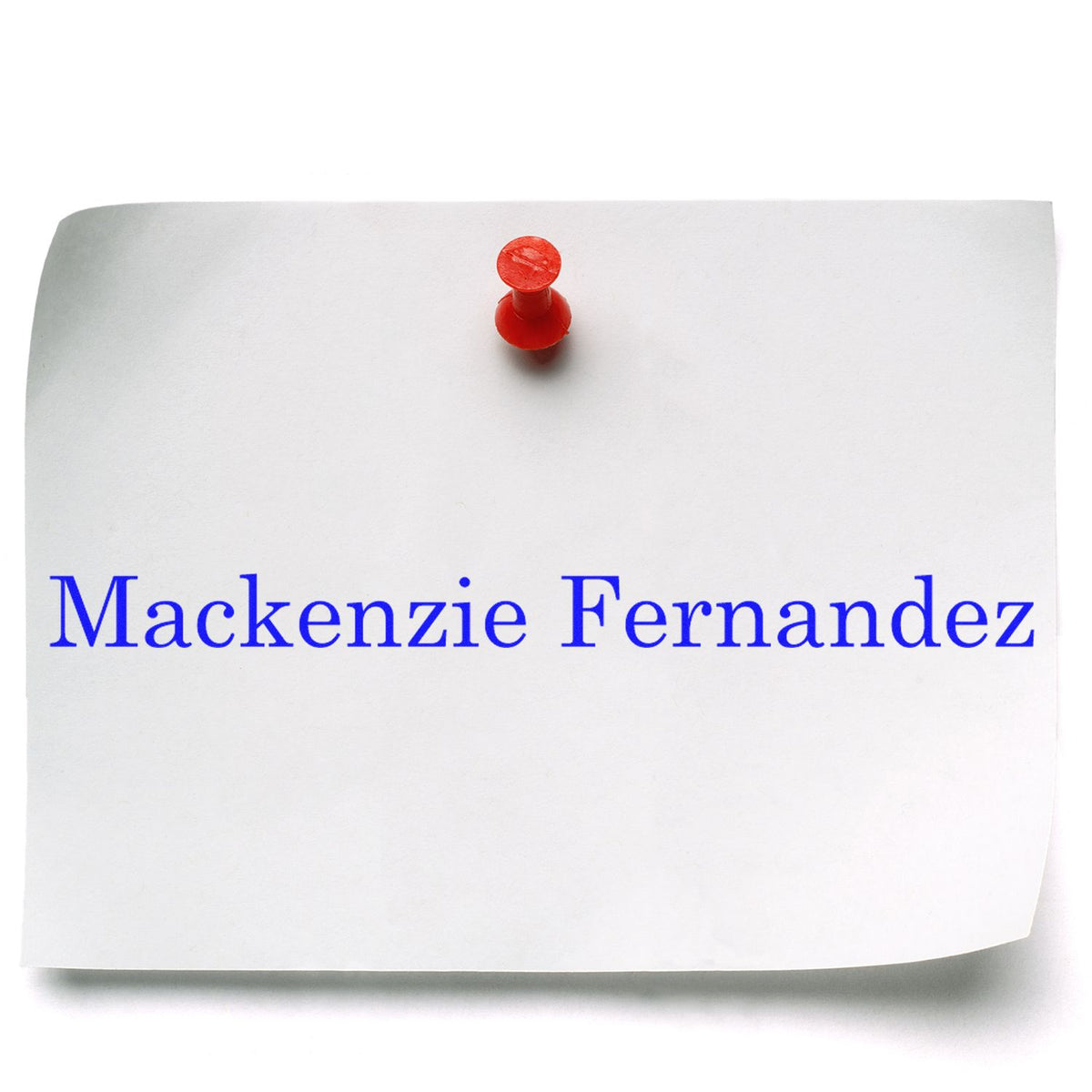 White paper card with red pushpin and blue Mackenzie Fernandez custom stamp seal imprint
