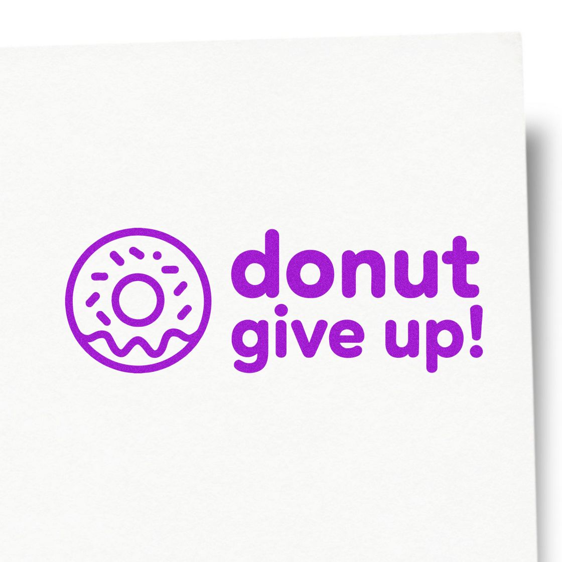Purple donut stamp and seal design with playful donut give up! text in bright purple on a white background.