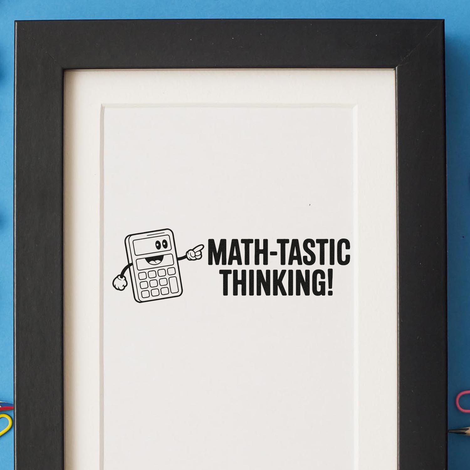 Black stamp with smiling calculator and text Math-tastic Thinking! on white paper, framed in black.