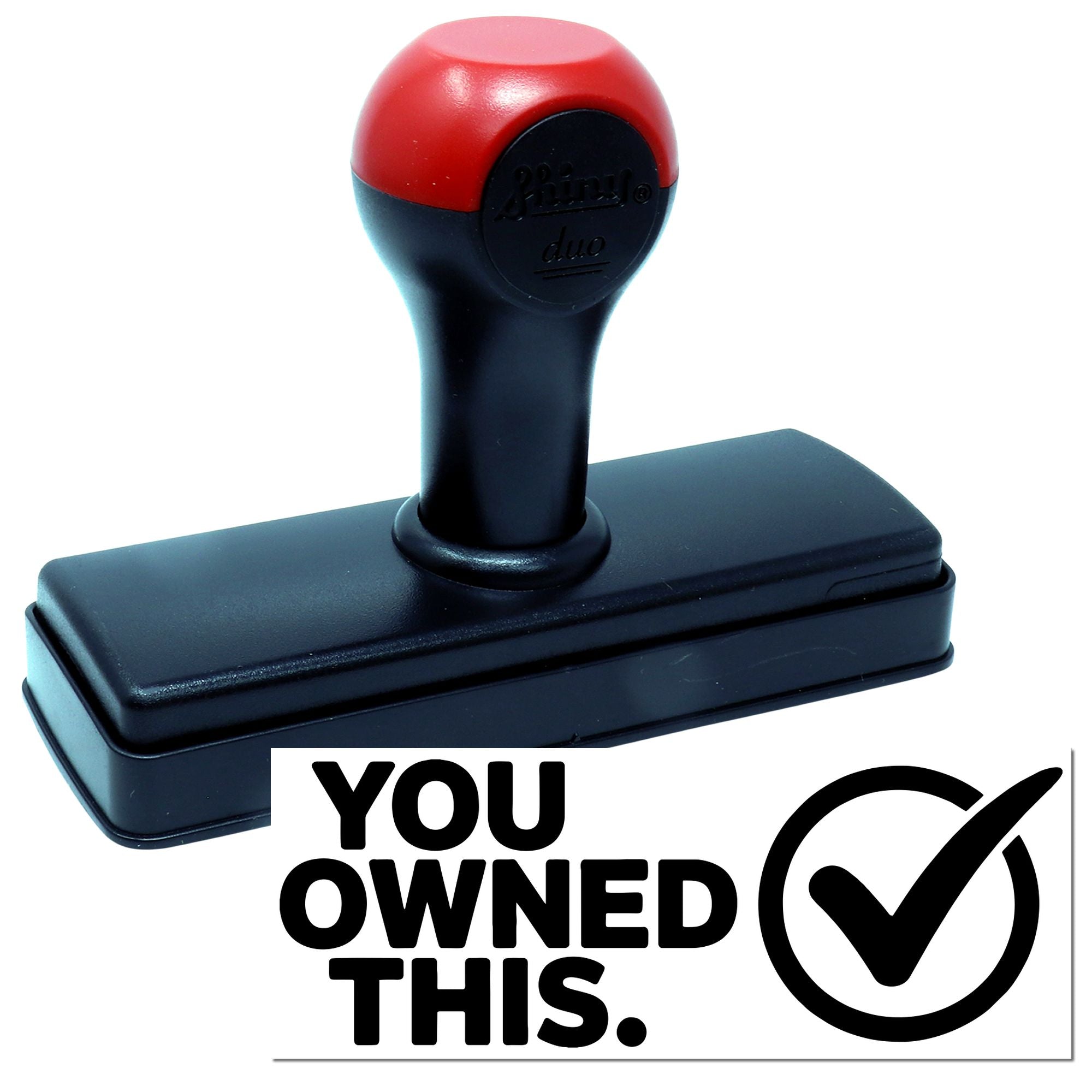 Red and black self-inking stamp with YOU OWNED THIS ownership seal and checkmark on white background