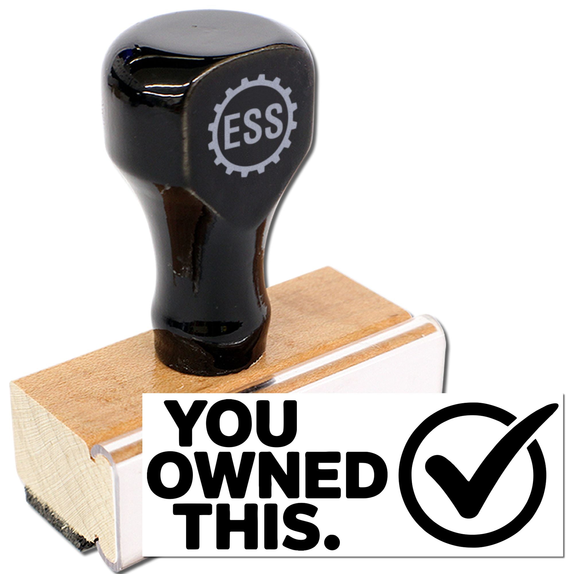 Black ESS rubber stamp on wooden base, featuring a YOU OWNED THIS seal with checkmark.