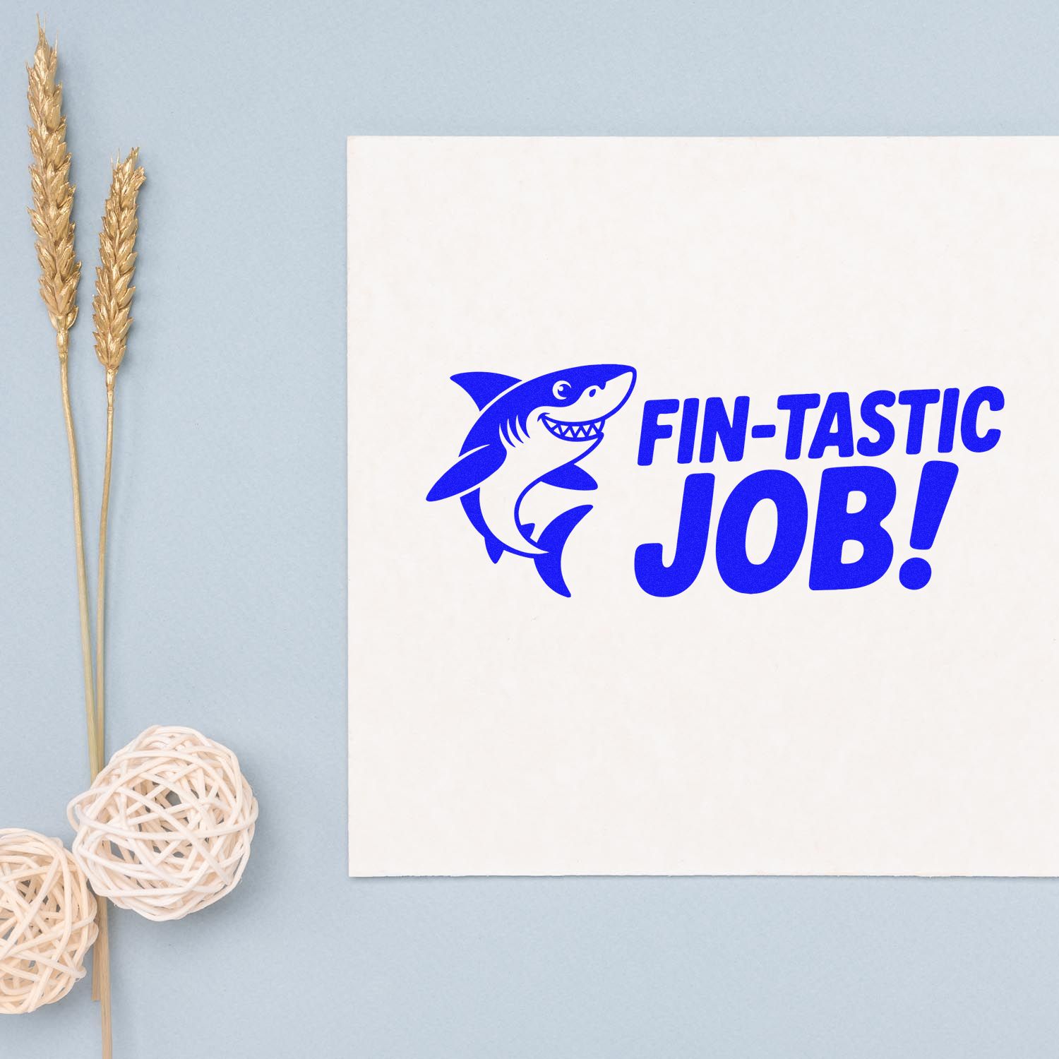 Blue shark FIN-TASTIC JOB! stamp and seal on white paper, with bold blue lettering and pale blue background.