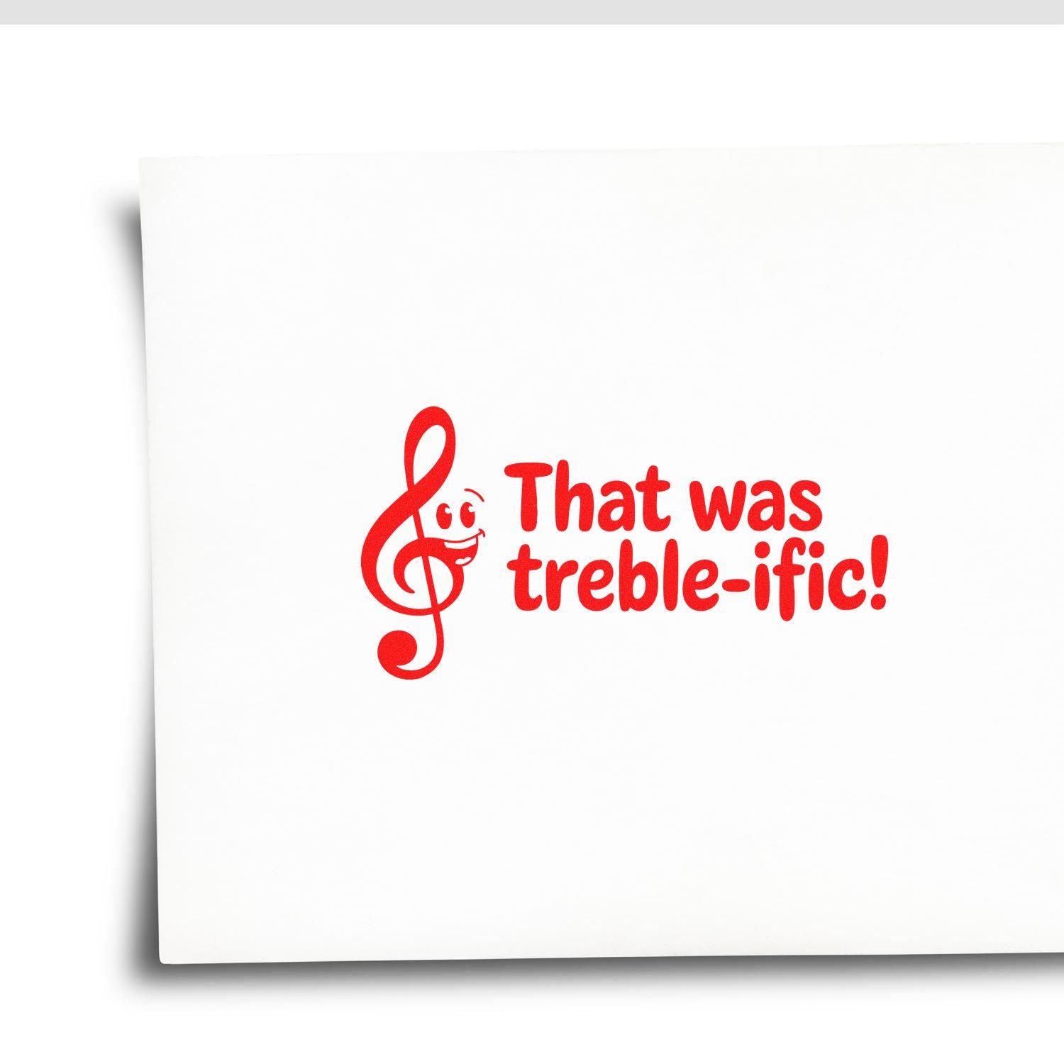 Red musical note stamp and seal reading That was treble-ific! on a white background.
