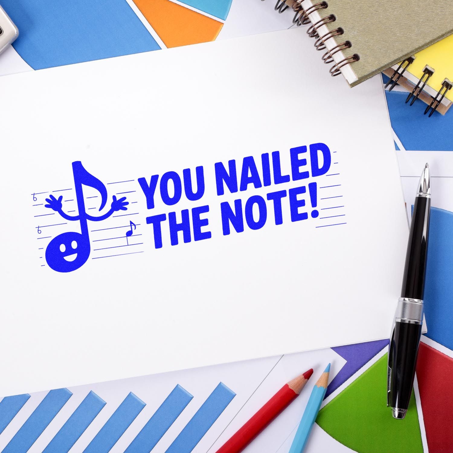 Blue You Nailed the Note! stamp and seal with musical note mascot on white paper, surrounded by colorful stationery.