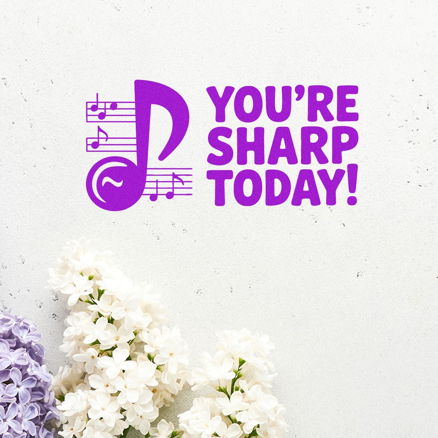 Purple music stamp seal reading YOURE SHARP TODAY! with note icon on a light textured background and white lilac flowers.